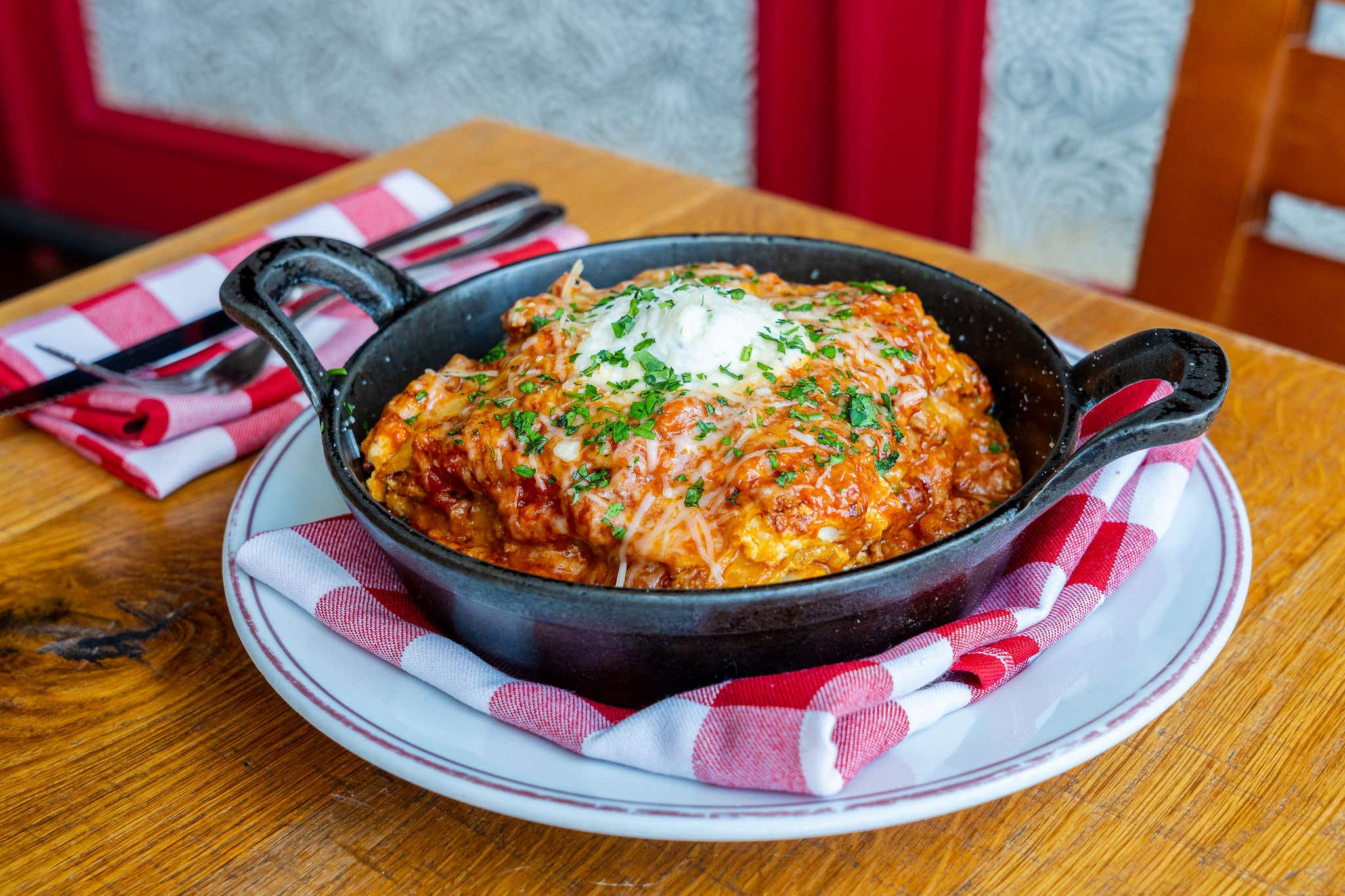 Cast iron pan full of lasagna